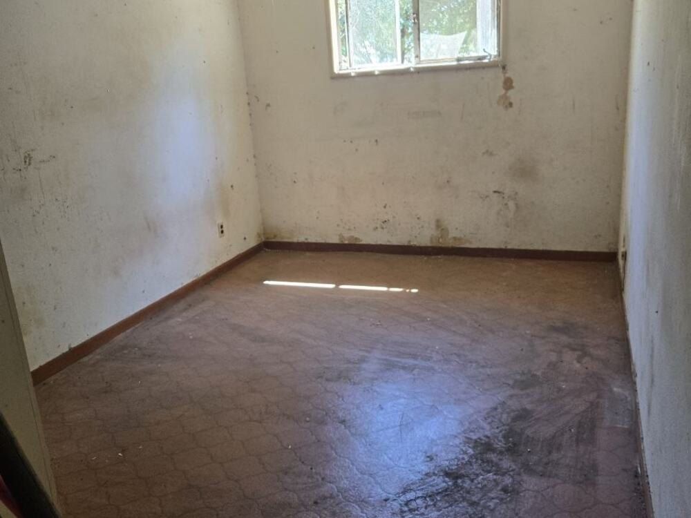 After: the same room empty, floor swept clean