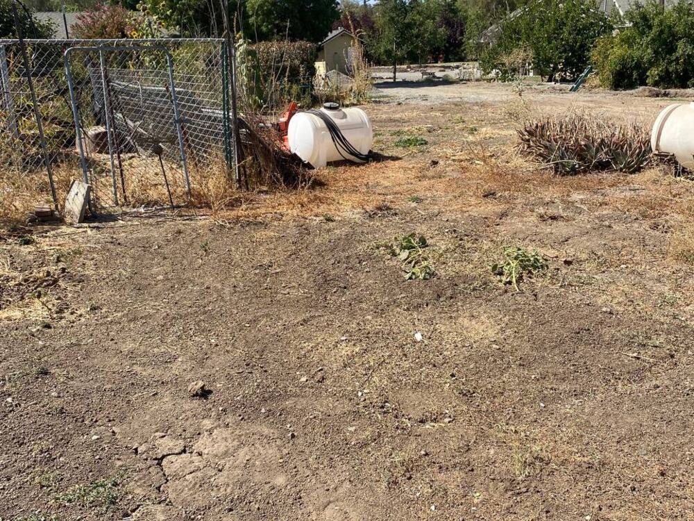 After: the same lot cleared and raked flat